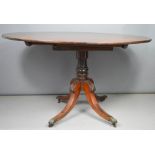 A 19th century mahogany oval tilt top table, 72 by 102 by 133cm.