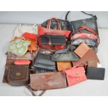 A quantity of vintage handbags and purses.