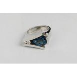 An 18ct white gold, blue topaz and diamond ring, modern design, size M, 14.6g.