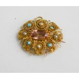 A yellow metal filigree work pendant / brooch, set with turquoise and seed pearl with topaz