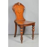 A 19th century mahogany shield back hall chair.