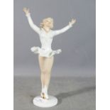 A Sitzendorf porcelain figure of an ice skater, 25cm high.