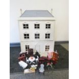 A large hand made dolls house complete with furniture.