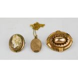 A yellow metal mourning brooch with woven hair enclosed beneath glass oval panel, together with a