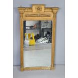 A 19th century gold painted wall mirror with column form sides 89cm high.