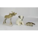 Three Russian ceramic figures; moose, badger and puppy.