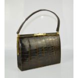 A vintage alligator skin hand bag with suede interior and additional mirror.