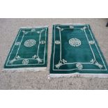 Two rectangular green ground Chinese rugs.
