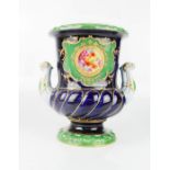 A porcelain urn, impressed II 349 to the base, the cobalt blue ground, twin handles, roundel to