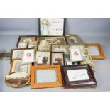 A quantity of vintage photographs and frames.