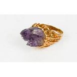 An amethyst and yellow metal ring, in naturalistic style mount, size Q, 9.4g.