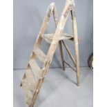 An antique A-frame ladder.