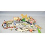 A group of lead painted toys, including farmyard animals, figurines, Dinky Riley car and others.