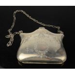 A silver Edwardian purse, engraved with bow and bell flower design, with chain, 2.35toz.