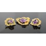 An amethyst and gilt metal brooch and earrings set.