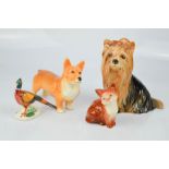 A Beswick kitten and pheasant, a Sylvac corgi, and a Yorkshire terrier.