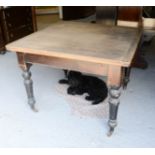 A Victorian pine extending dining table, 106 by 106 by 77cm.