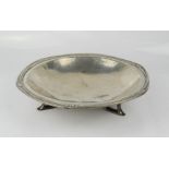 An Art Nouveau pewter footed dish, with hammered finish.