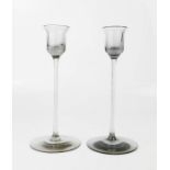 Two Wedgwood smoky glass candleholders.