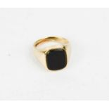 A 9ct gold and onyx signet ring, with cushion shaped black onyx and plain shank, A & Co of