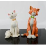 A pair of Disney ceramic figures 13cm high.