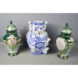 A pair of limoges vases with cover, oil lamp and blue and white Chinese vase.