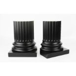 A pair of David Linley book ends, column form, ebonised finish, 19cm high.