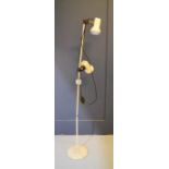 A retro standard lamp in cream.