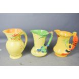 Three Burleigh ware jugs: Parrot 7017, Dragon 5118, Kingfisher 5103.