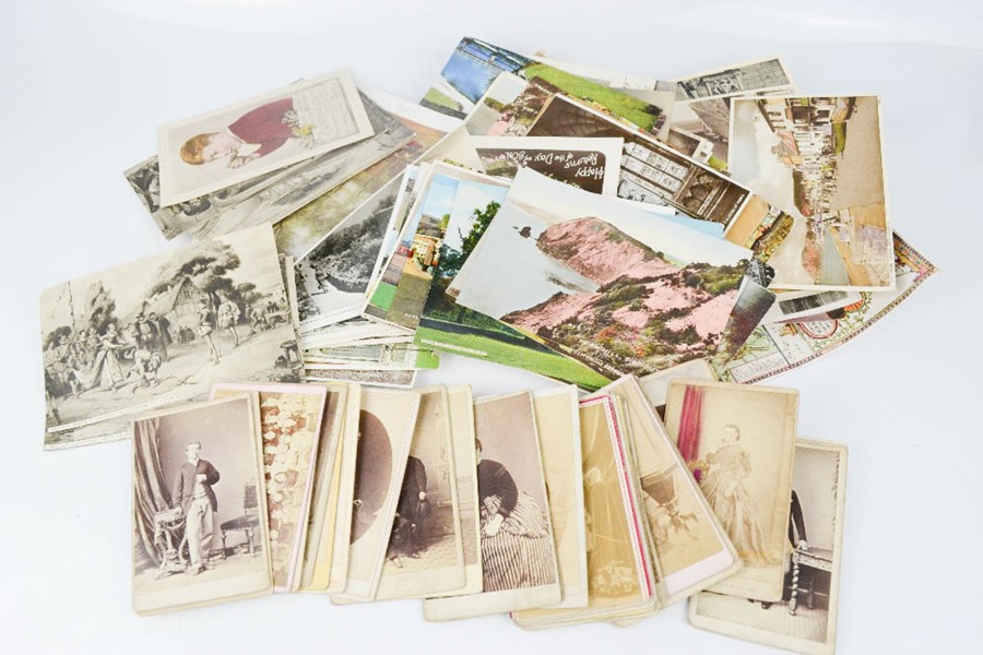 A group of postcards and old photographs.