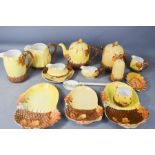 A group of Burleigh ware, in the Autumn Leaves pattern, with acorn finials and dishes, including