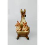 A kangaroo and joey form cruet set, 15cm high.