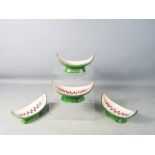 A set of four watermelon dishes.