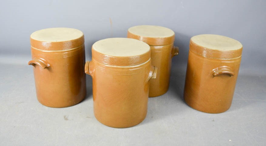 Four French vintage stoneware glazed jars by Renault Berry, 21cm high.