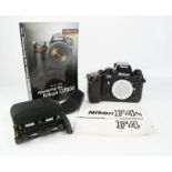 A Nikon F$ camera body, together with flash, instruction manual and a book 'Mastering the Nikon