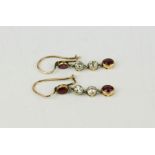 A pair of ruby and diamond drop earrings in yellow metal setting, 2.1g.