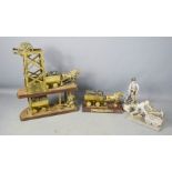 A Whitwell Colliery 1800-1986 commemorative brass model, and two David Fisher mining models.