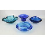 A group of four blue Murano and retro glass dishes.