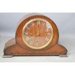 A Smith 1930s mantle clock with Roman Numeral dial, and wooden dial.