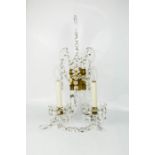 A pair of French crystal, glass and ormolu wall lights.