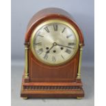 A 19th century mahogany cased dome top mantle clock, with Roman Numeral dial, brass columns, ball