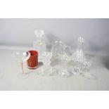 A group of glassware to include decanter, carafe, jug, retro champagne glass, and other items.