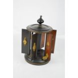 A Victorian ebonised revolving cigarette holder, 20cm high.