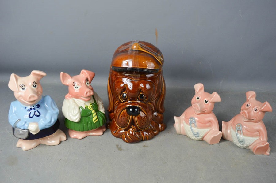 Four Wade Natwest piggy banks and a P&K biscuit barrel.