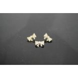 A Butler & Wilson bow form brooch and earring set.
