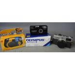 An Olympus 35RC Camera together with an Olympus II and Kodak disposable camera.