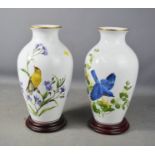 A pair of Franklin mint vases; The Goldfish in Autumn, AJ Rudigill and The Bluebirds of Summer, 32cm
