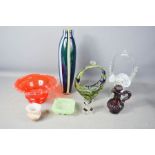 A group of retro glassware, including a murano basket, tall vase and vaseline glass ashtray.