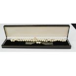A pearl necklace set.
