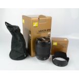 A Nikon Nikkor Lens AF-S DX 18-105mm lens and Bayonet Lens Hood HB-32 both boxed.